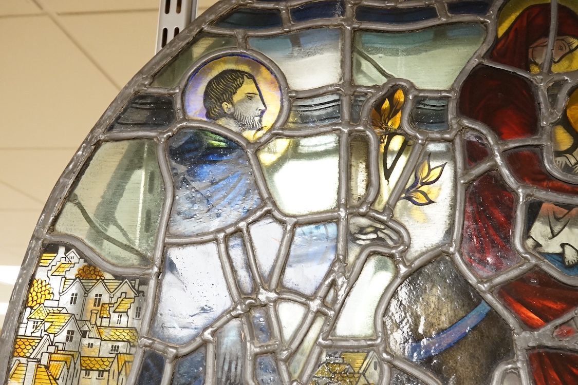 A 20th century semi circular stained glass panel, approximately 80cm wide